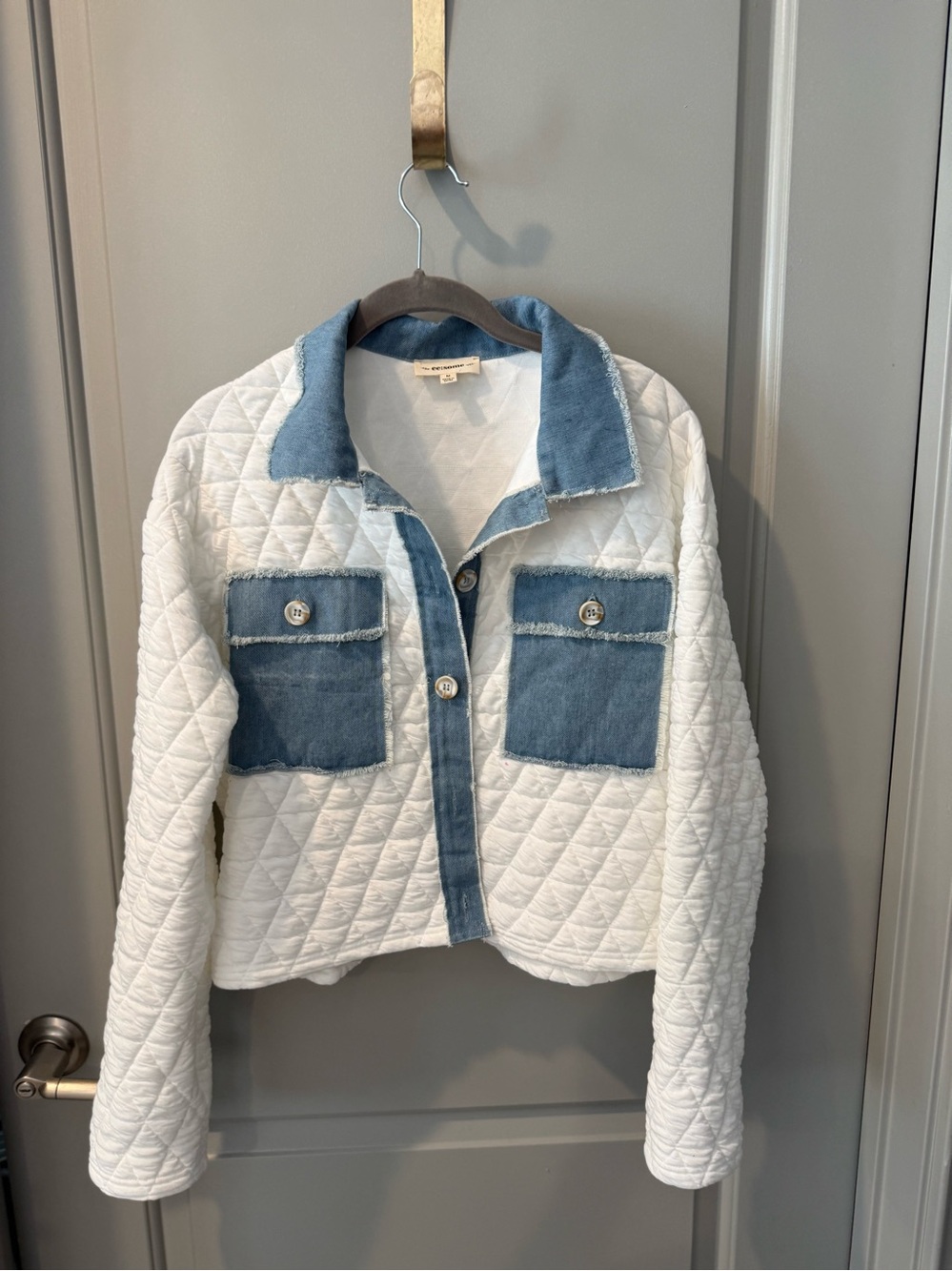 eesome White Quilted Jacket with Denim Blue Trim. Womens size M.  Fits like a L